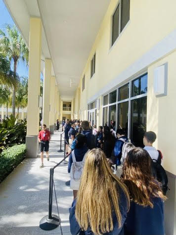 Tens of students line up outside the lunch room