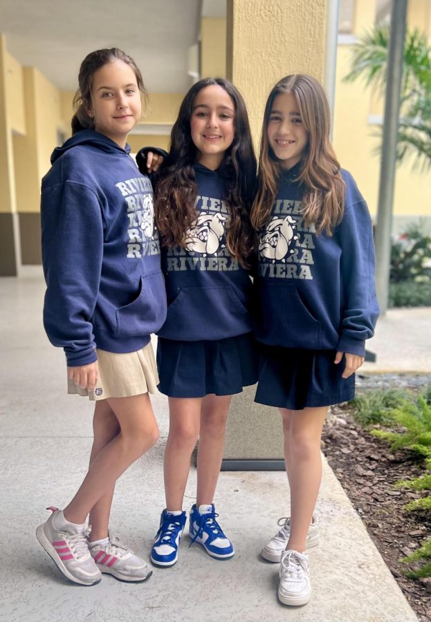 6th graders Martina Duran, Catherine Braceras, and Sofia Cerda posing with their Riviera Hoodies. 