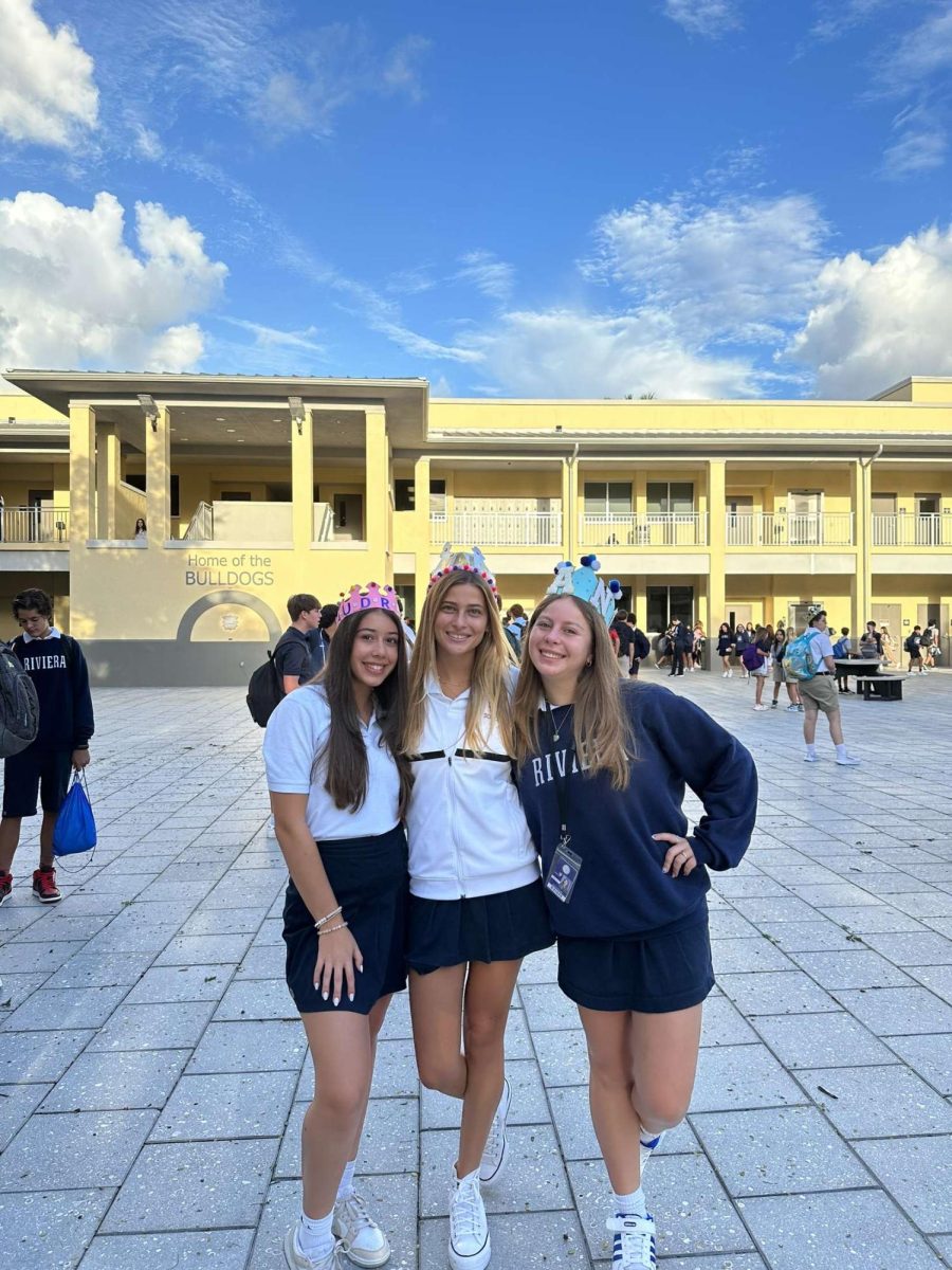 Before the bell rings for class, students show off their senior crowns. Audrey Pena, 12, Valentina Briatore, 12, and Daniella Romano, 12 chose a variety of colors and patterns to symbolize special accolades or moments.   “This crown represents me because I went with a pink and blue theme going along with my SGA campaign and I wanted to wear my favorite colors that represent who I am.” Said Audrey Pena. 