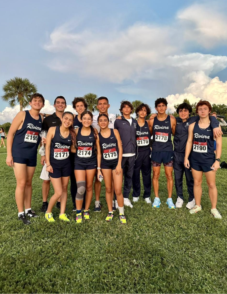 Varsity cross-country team posing for a picture at the end of a game