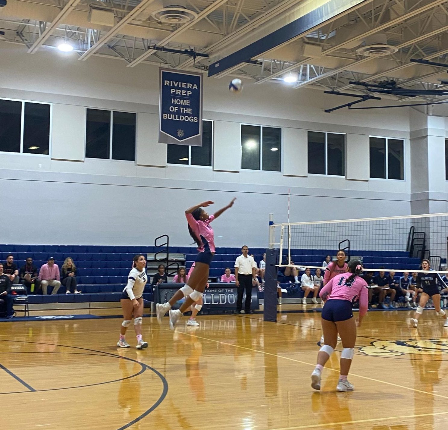 Sydney Zanca takes flight to deliver a strike from the backrow.