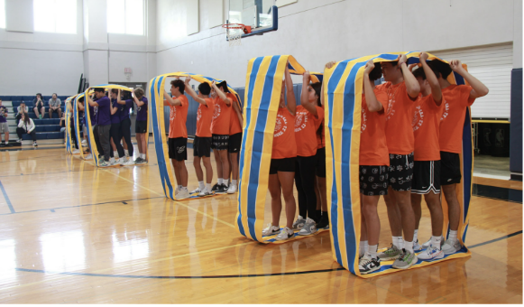 In one of the more memorable events, students teamed up for a race across the gym. 