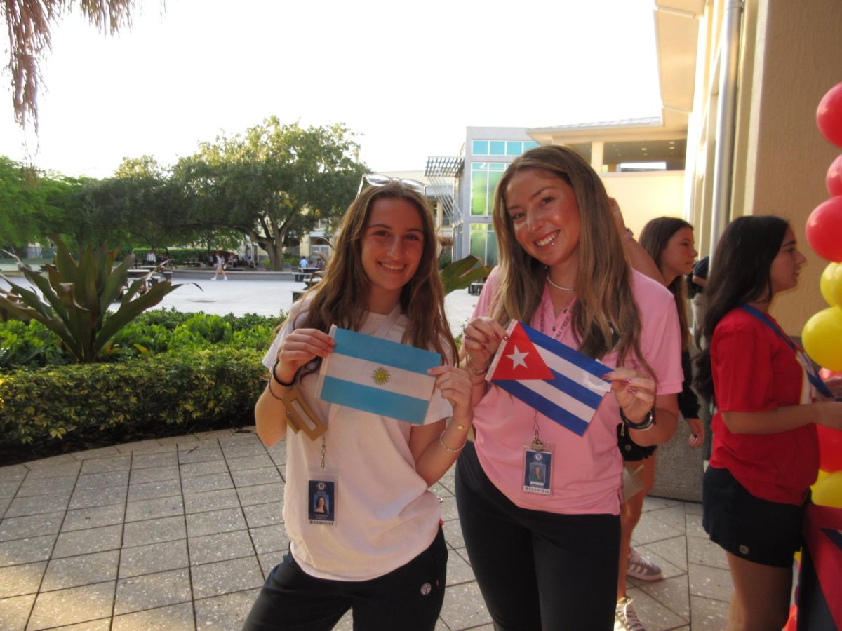 Sol Waizbrot and Ms. Sanchez show off their Argentinian and Cuban flags to celebrate Hispanic Heritage Month.