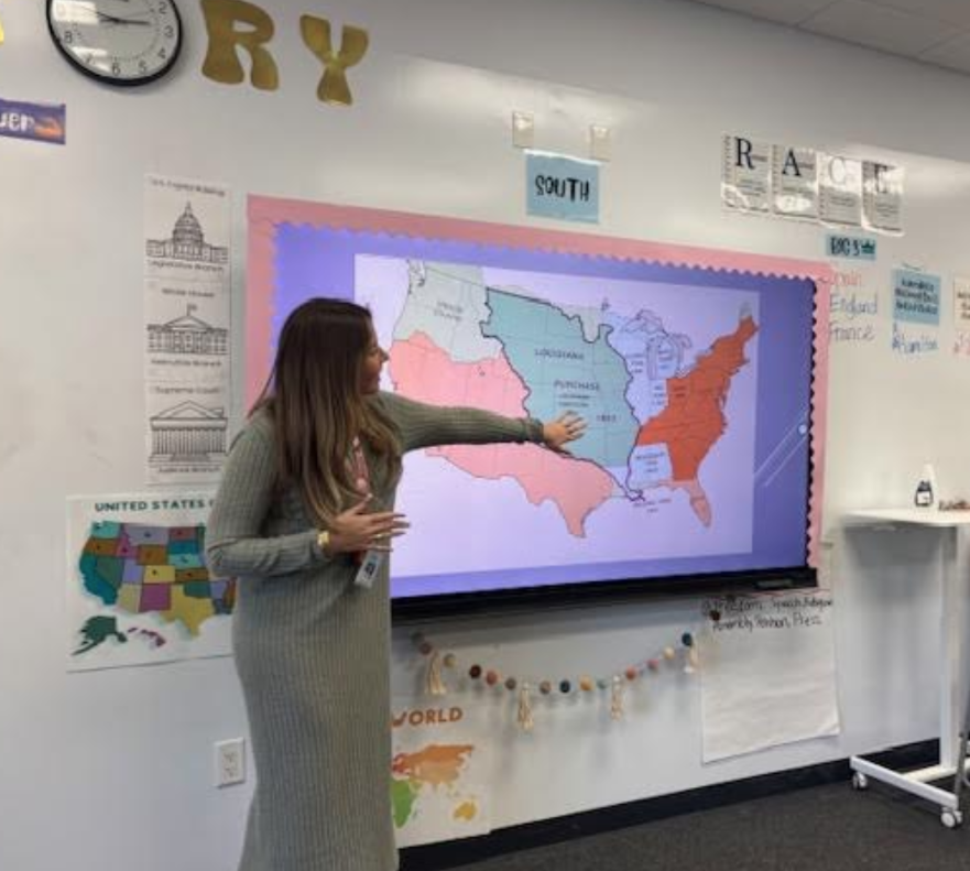 Ms. Sanchez, one of the government teachers at Riviera, teaching a lesson on United States maps during class.