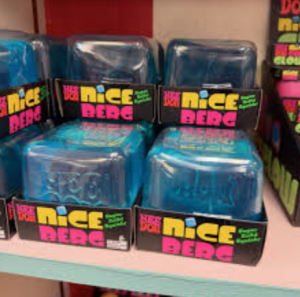 Brightly packaged NeeDoh stress balls line a retail shelf. Unlike past fidget trends, the small sensory toys are designed to be silent and discreet, making them more classroom-friendly.